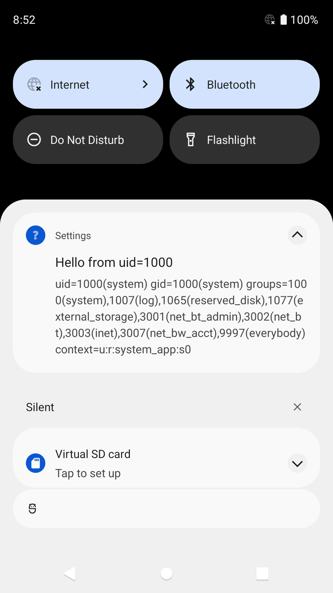 Captura de pantalla de la notificación de Android de la app de Configuración: Hello from uid=1000(system) gid=1000(system) groups=1000(system),1007(log),1065(reserved_disk),1077(external_storage),3001(net_bt_admin),3002(net_bt),3003(inet),3007(net_bw_acct),9997(everybody) context=u:r:system_app:s0